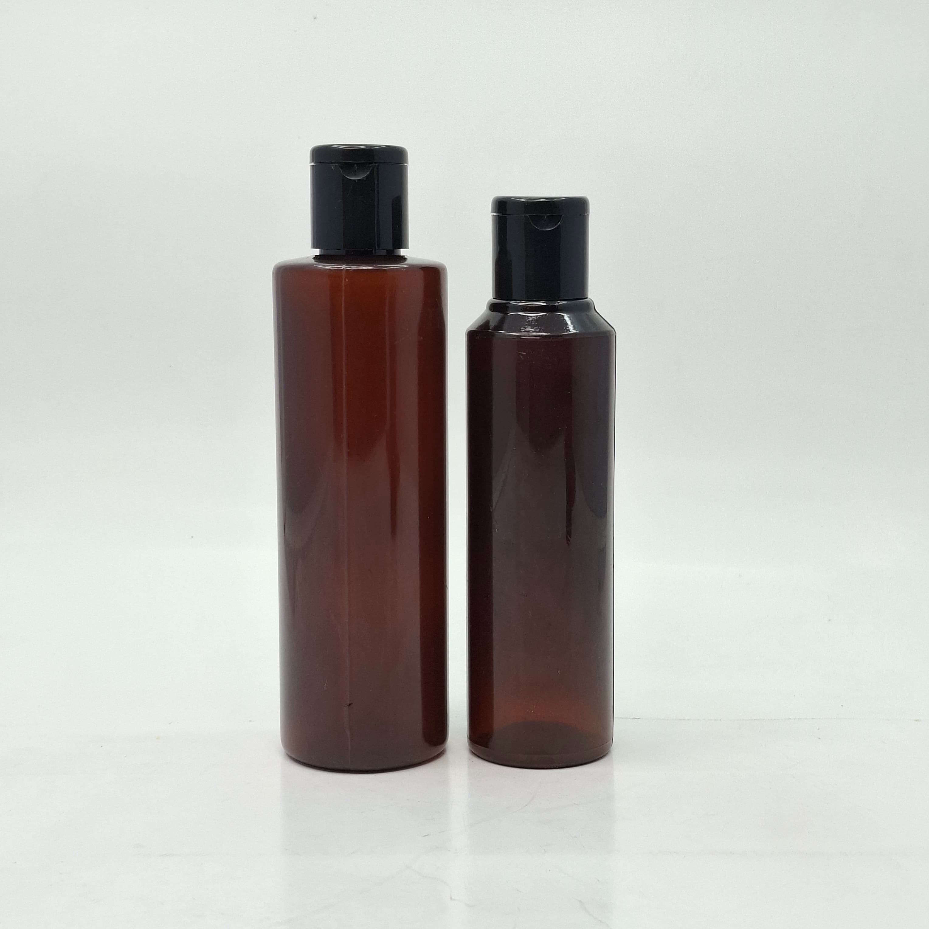 Main image of Round Amber Bottle - Flip Top Lids Black