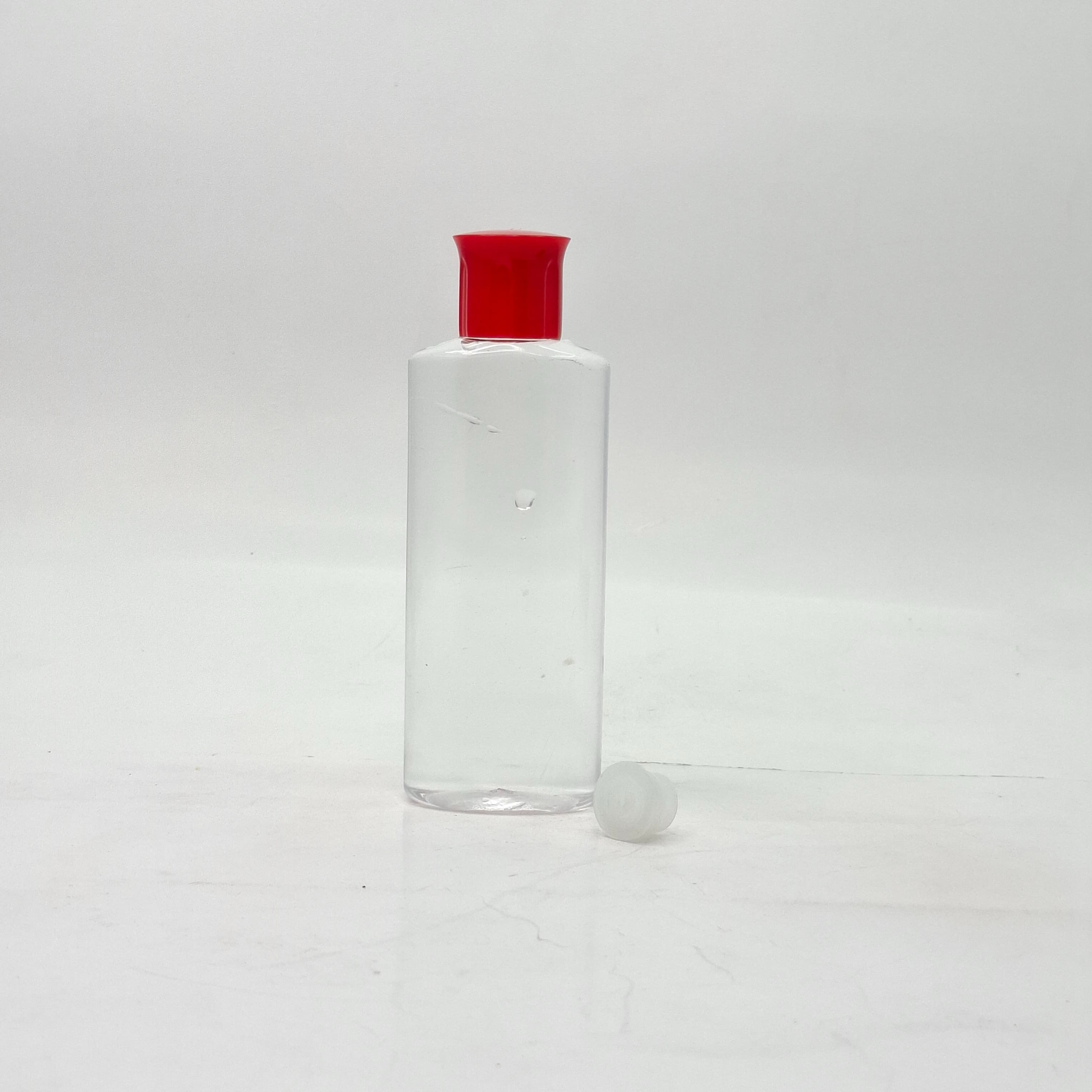 Main image of 100ml Oval Bottle Clear - Oil Lid Red