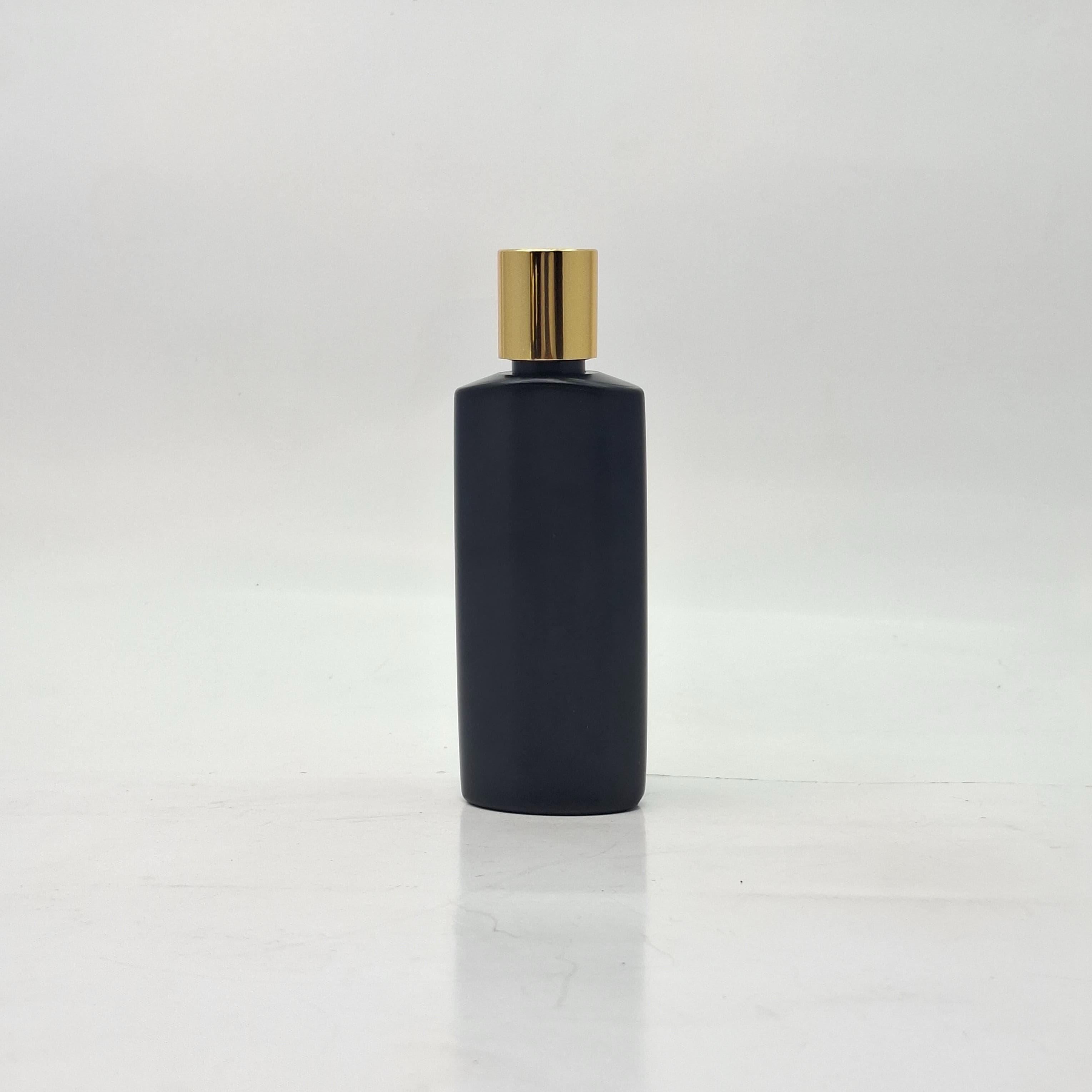 Main image of 100ml Oval HDPE Black Bottle - Press Lid Gold 