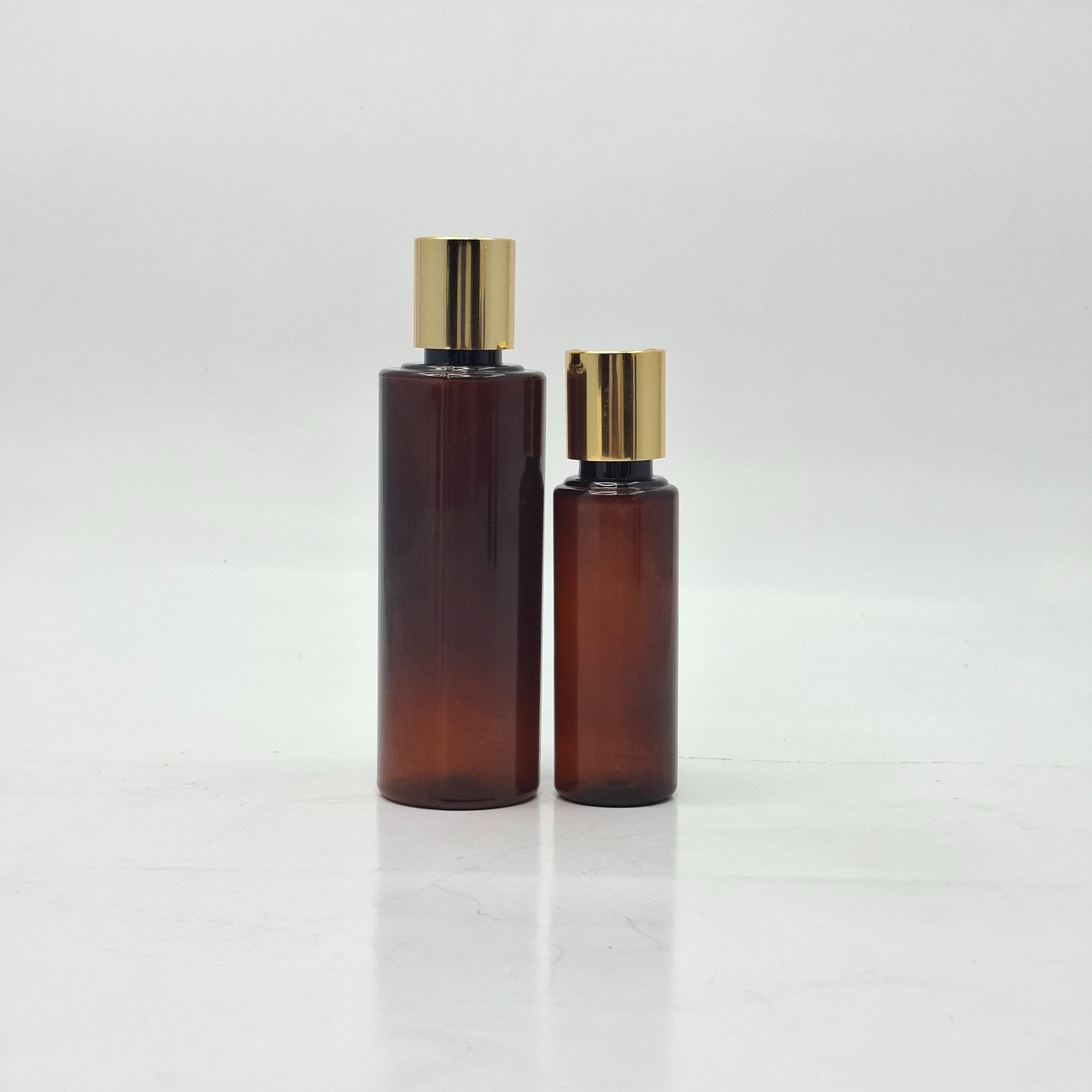 Main image of Amber Round Bottle - Press Cap Gold