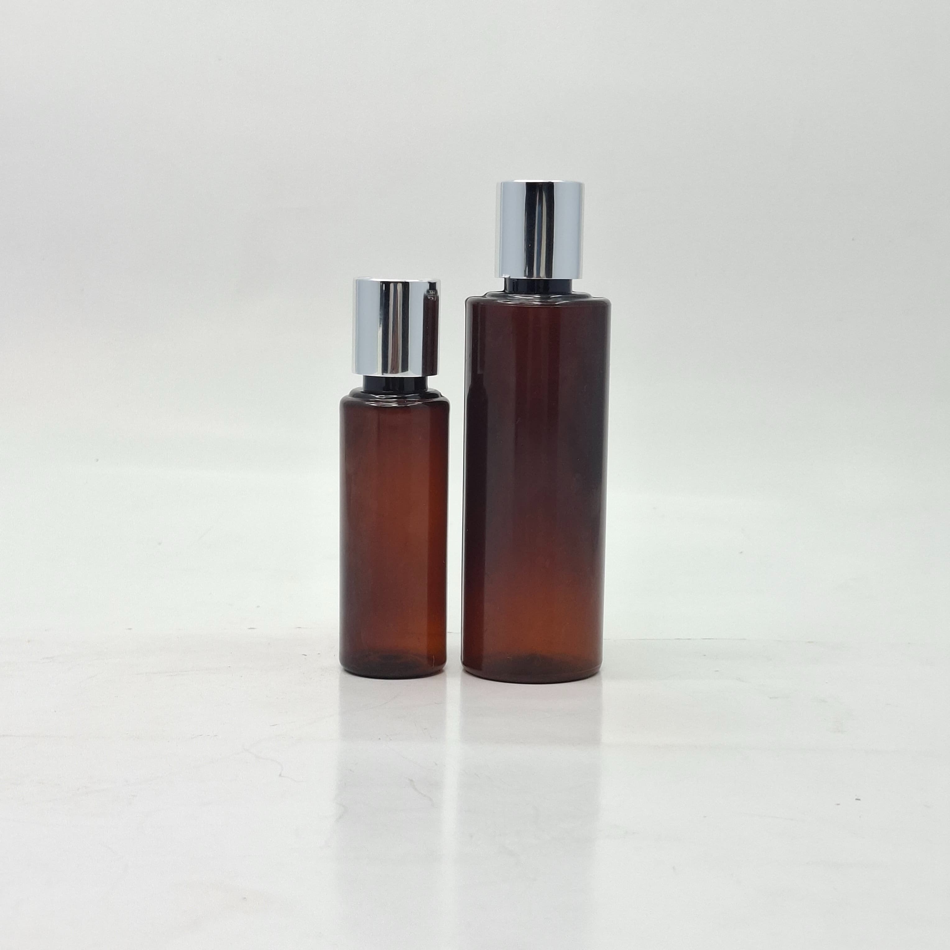 Main image of Amber Round Bottle - Press Cap Silver