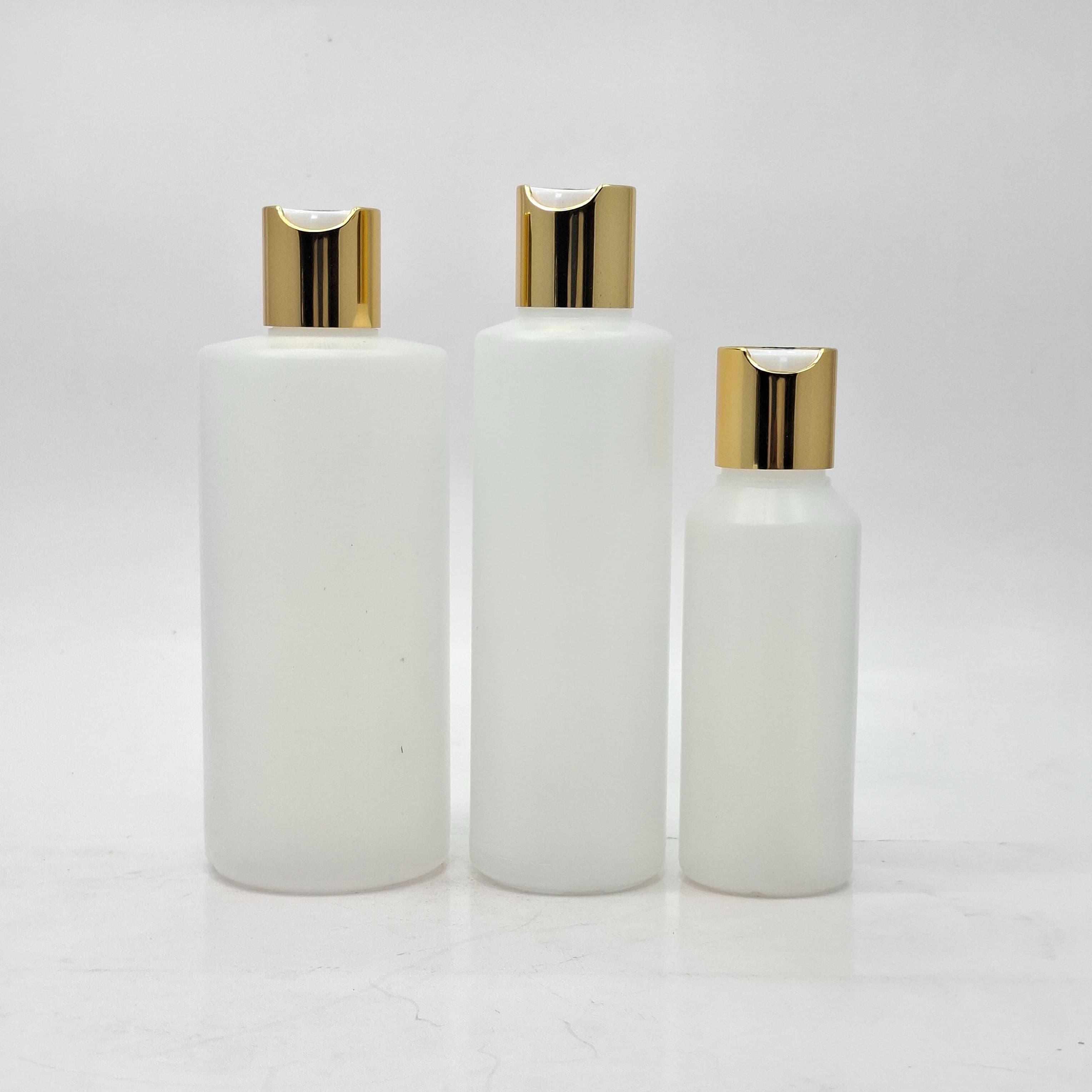 Main image of Round HDPE Clear Bottle - Press Lid Gold