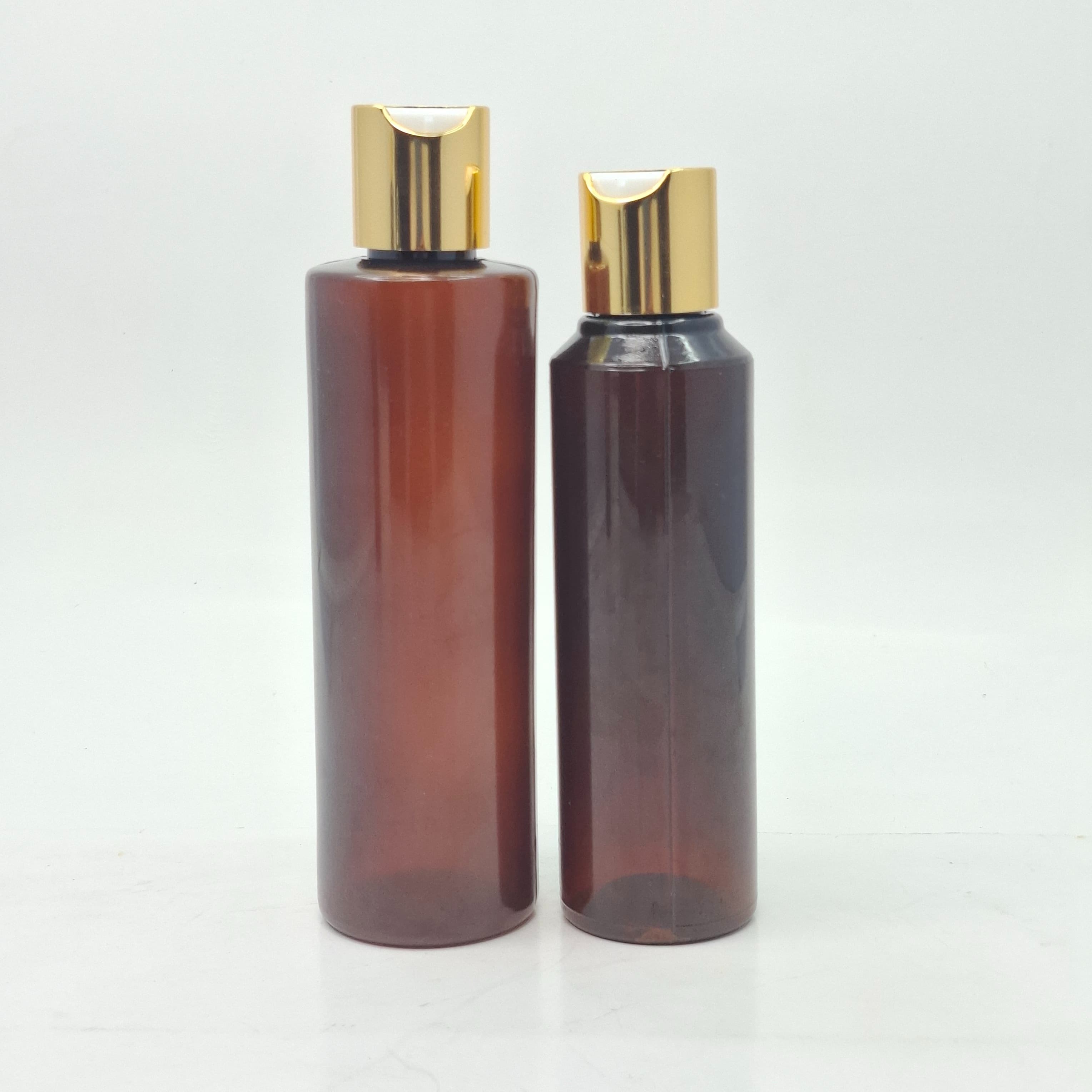 Main image of Round Amber Bottle - Press Cap Gold