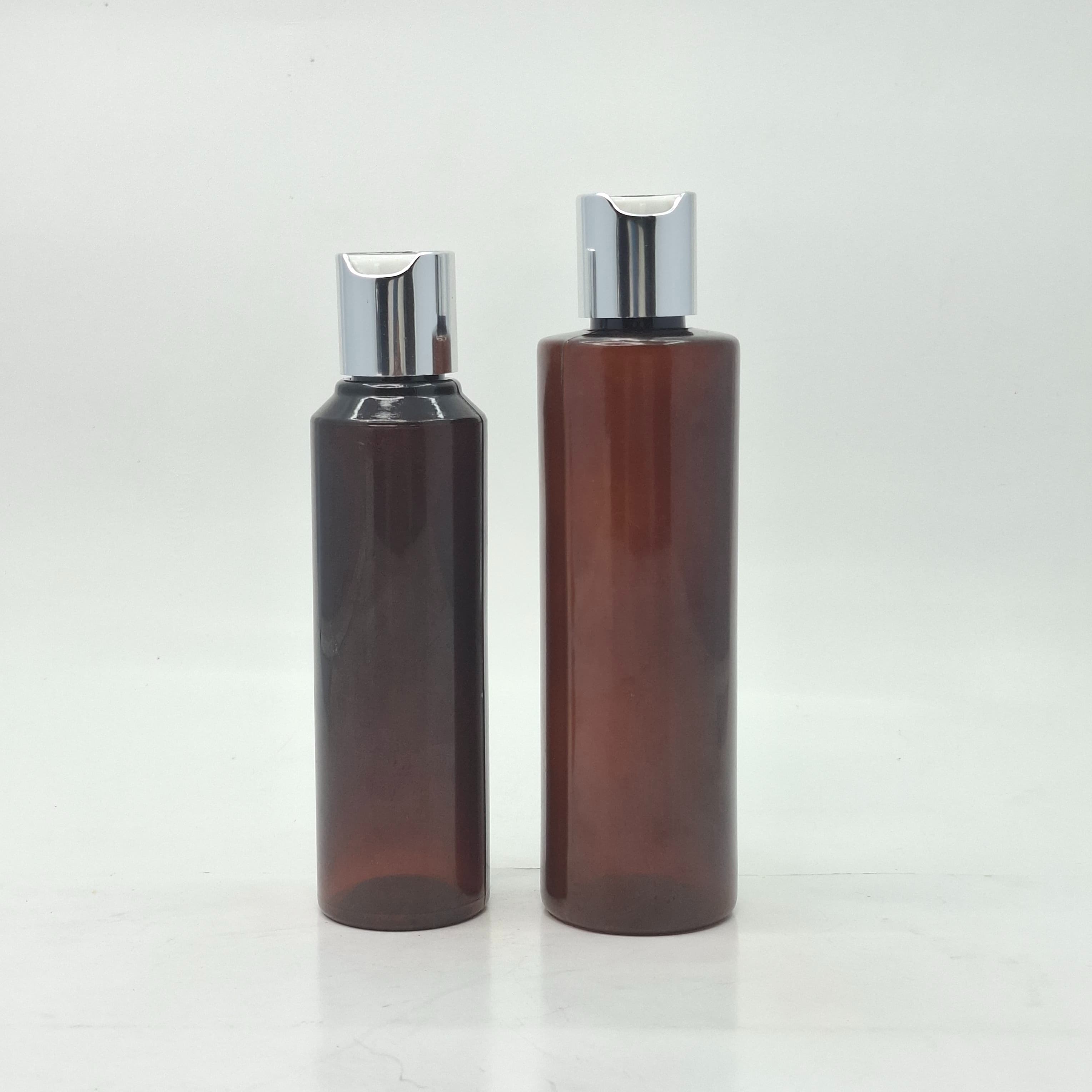 Main image of Round Amber Bottle - Press Cap Silver