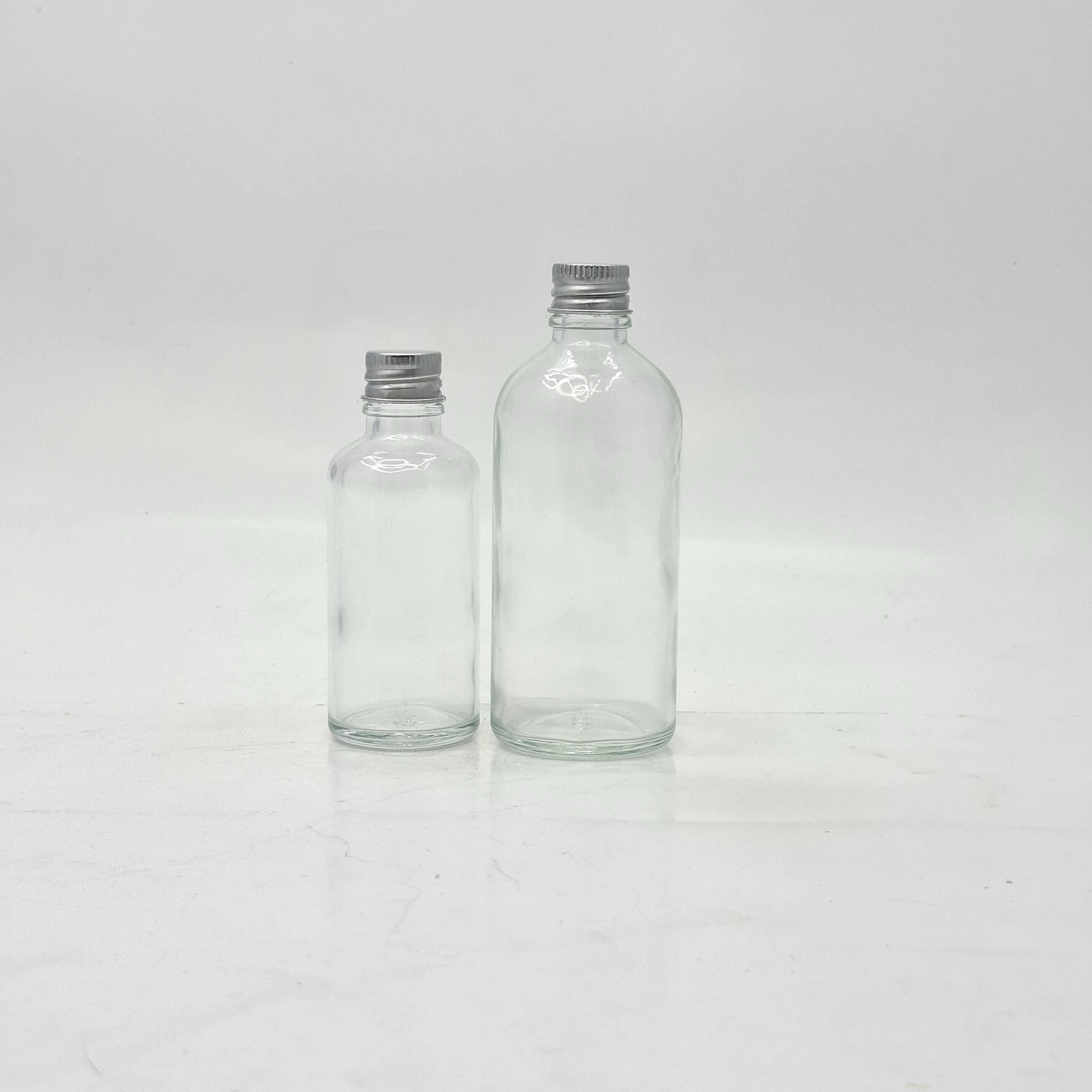 Main image of 50ml-100ml Clear Glass Bottle - Alu Lid Silver