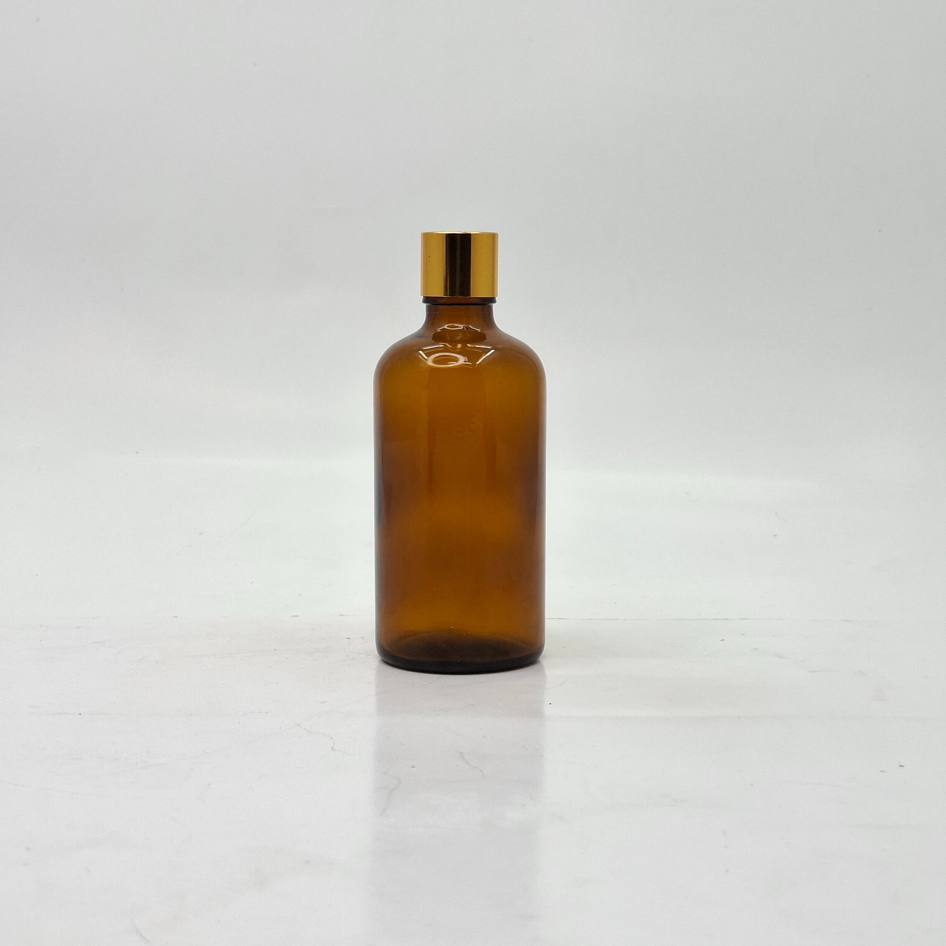 Main image of 100ml Amber Glass Bottle -18mm Shine Gold Lid with insert
