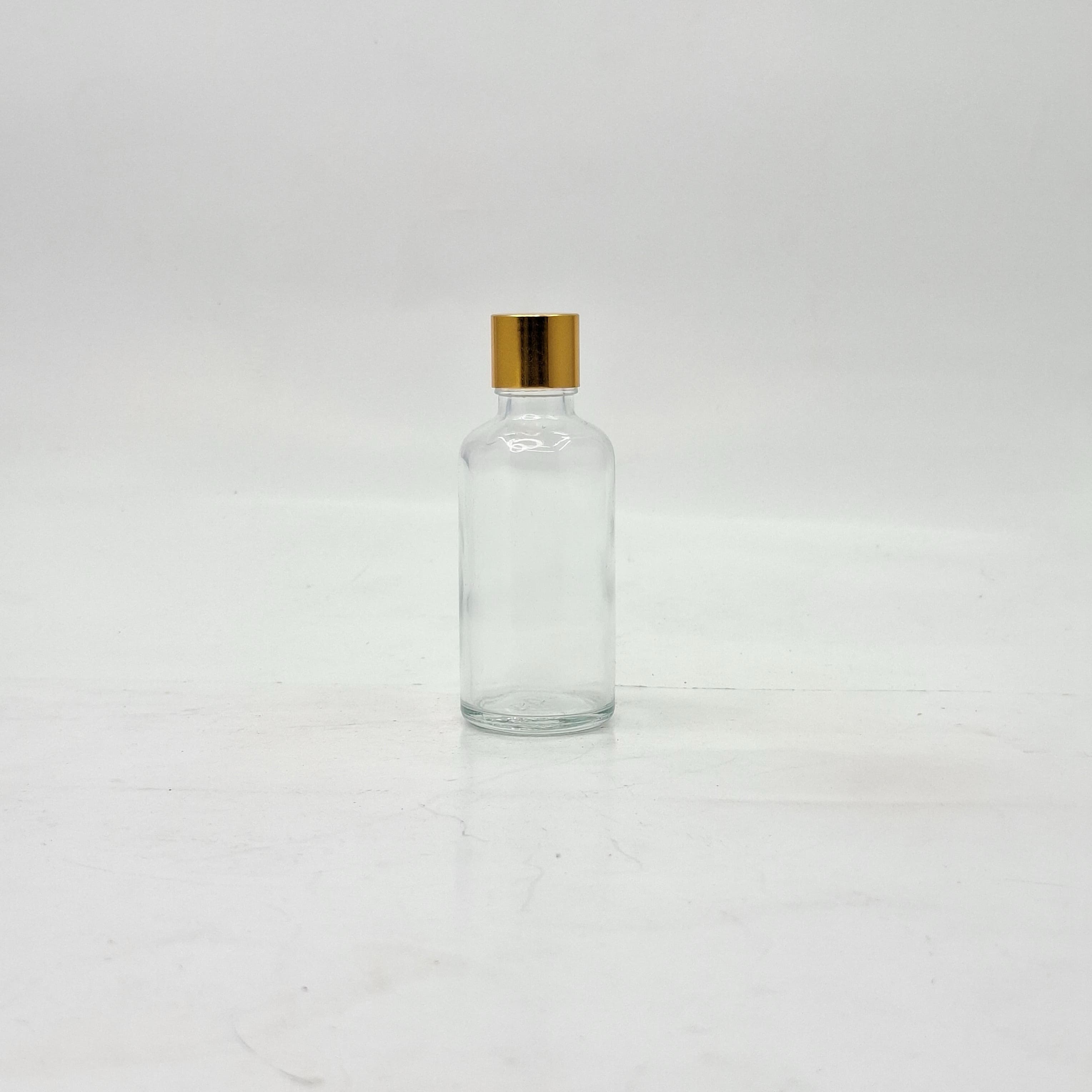 Main image of 50ml Clear Glass Bottle -18mm Shine Gold Lid with insert