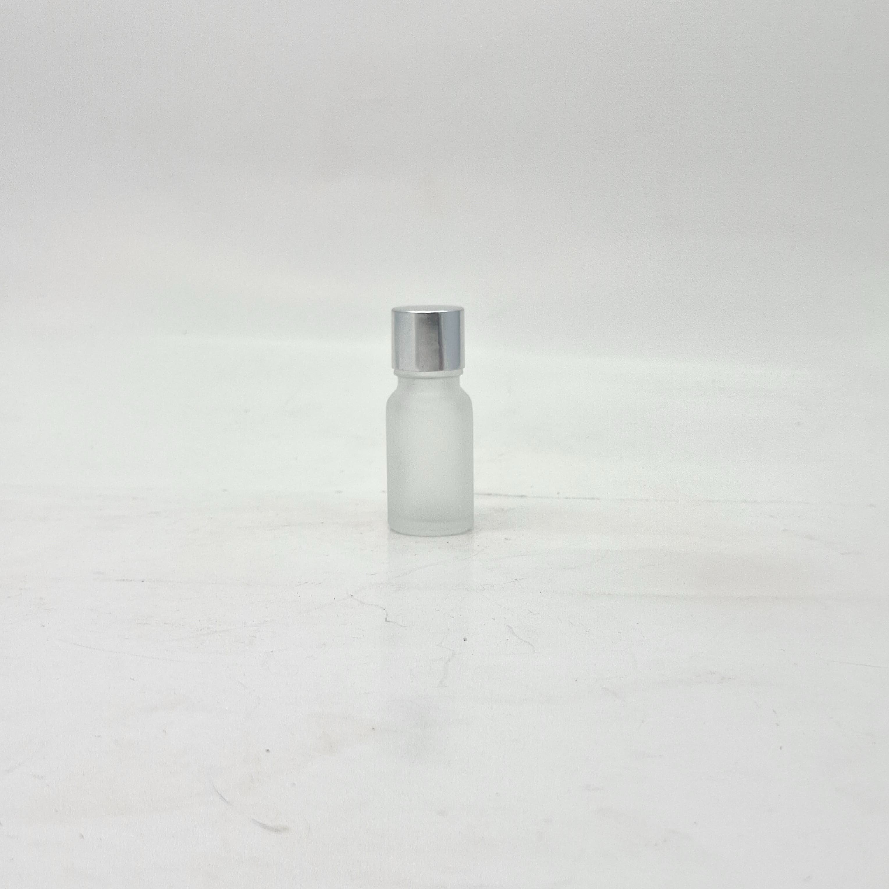 Main image of 10ml Frosted Glass Bottle -18mm Shine Silver Lid with insert