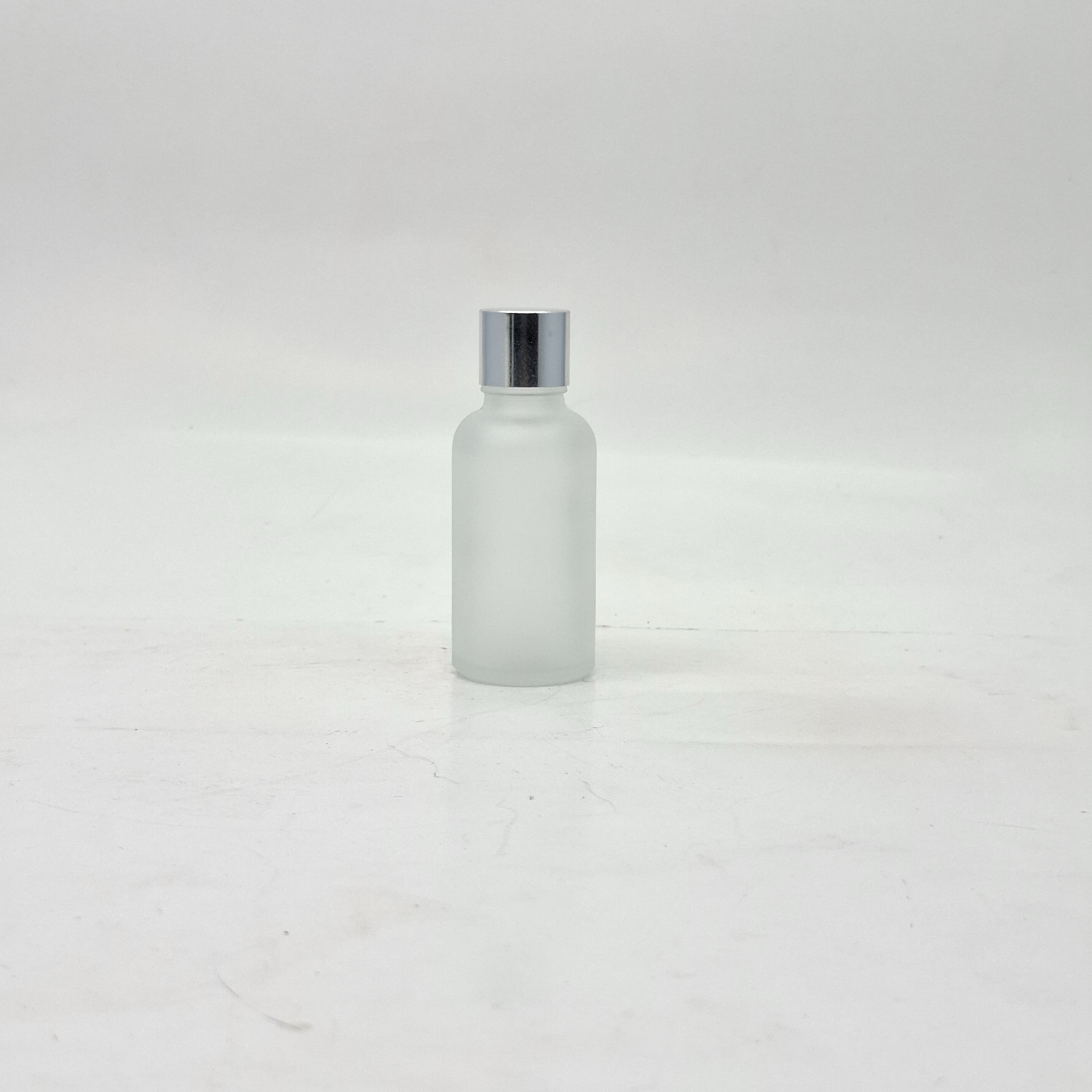 Main image of 30ml Frosted Glass Bottle -18mm Shine Silver Lid with insert