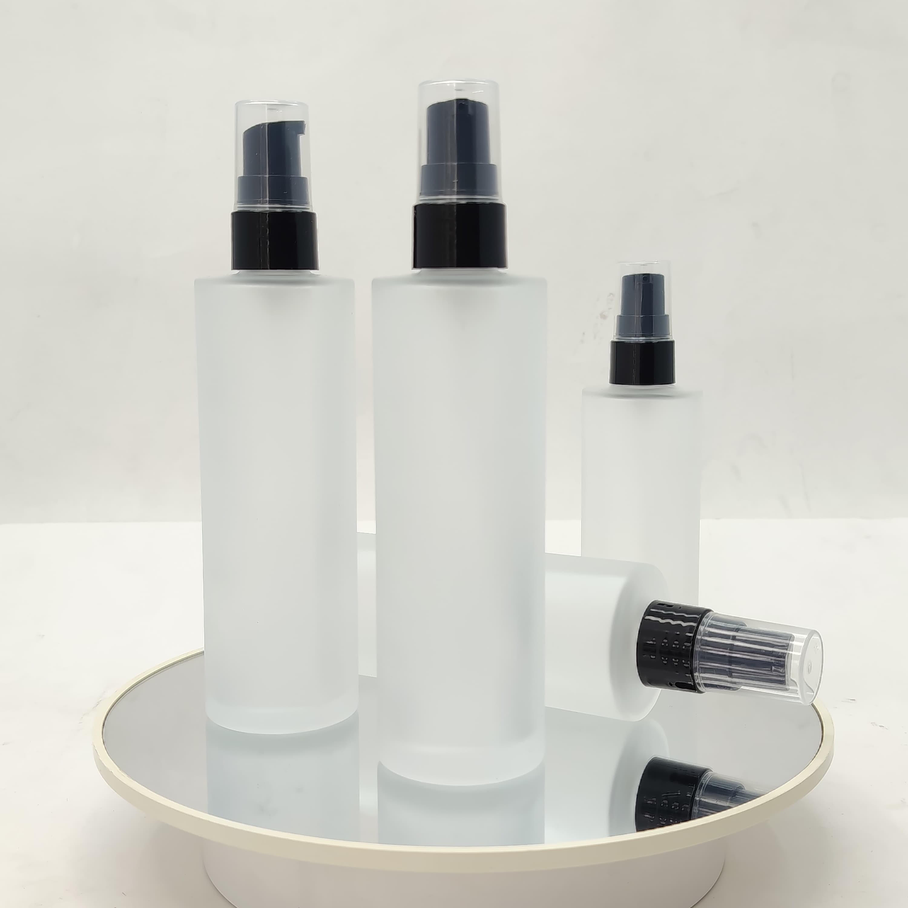 Main image of 100 ml Frosted Glass Bottle - Black Drop Pump 