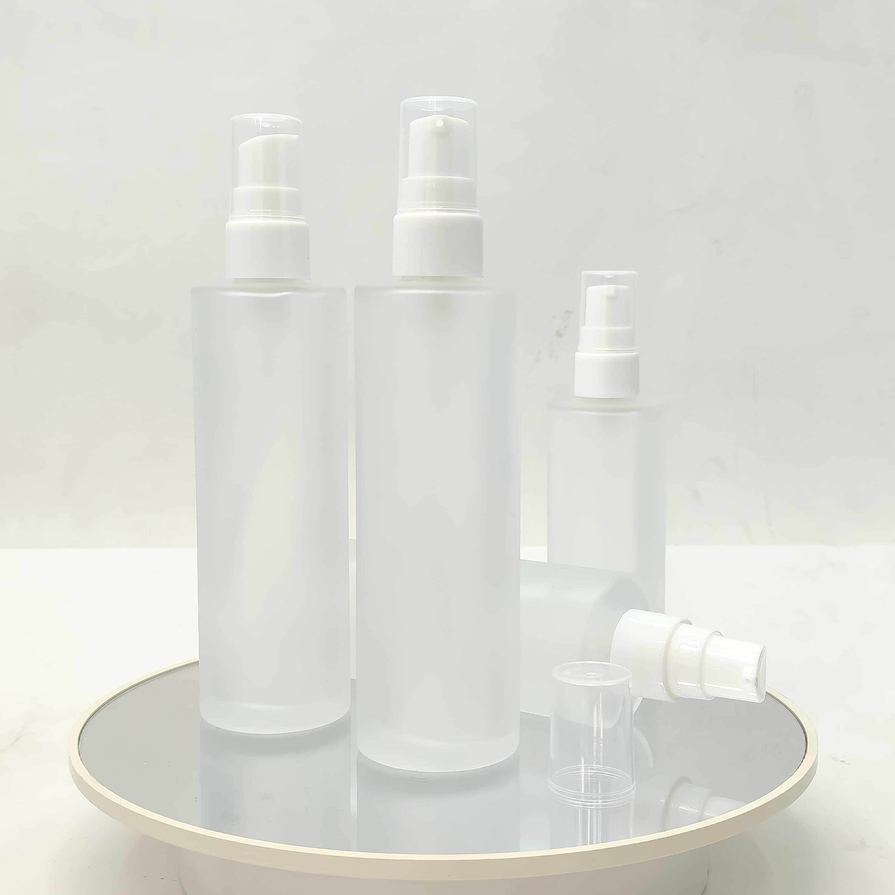 Main image of 100 ml Frosted Glass Bottle - White Drop Pump 