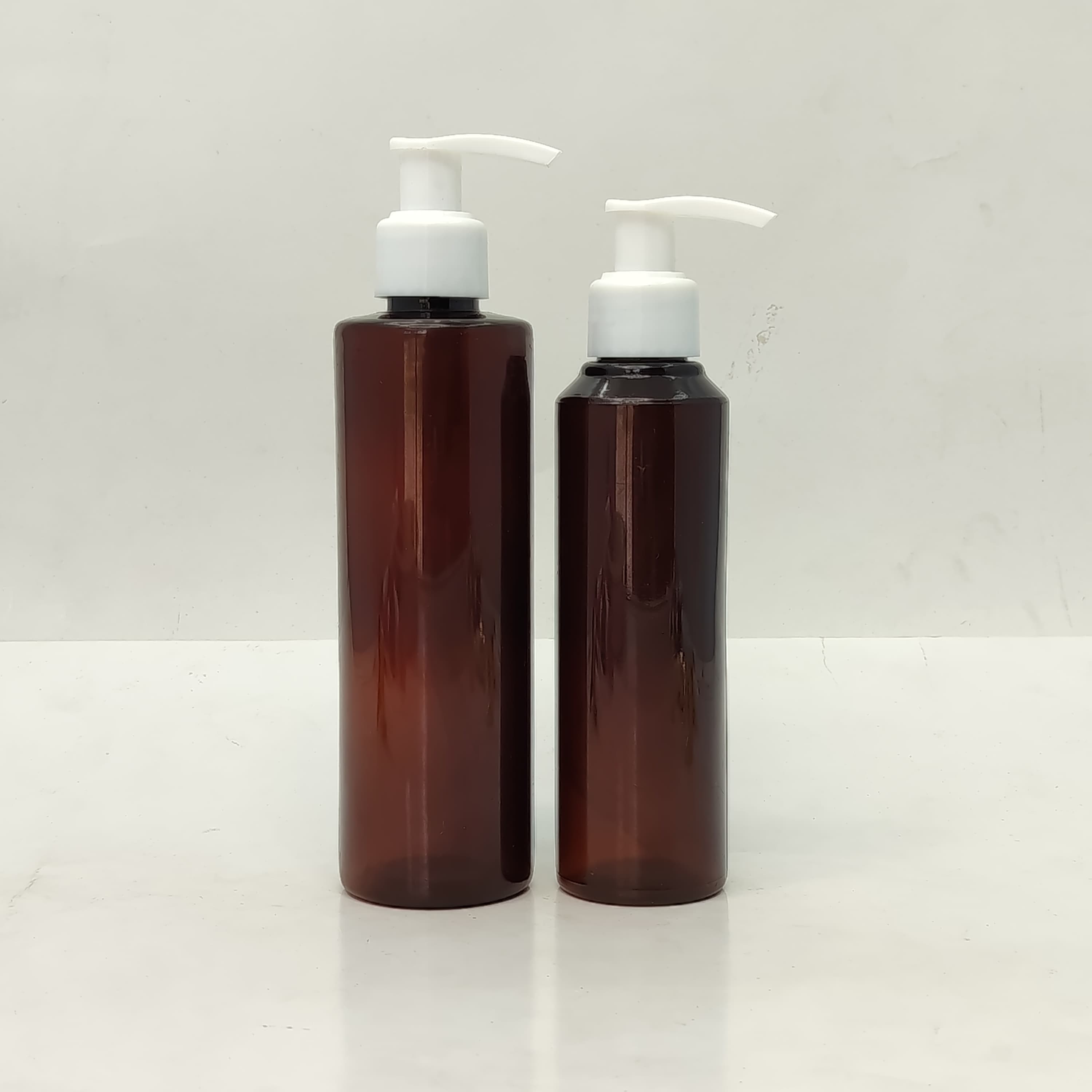 Main image of 150ml-200ml Round Amber Bottle - White Pump