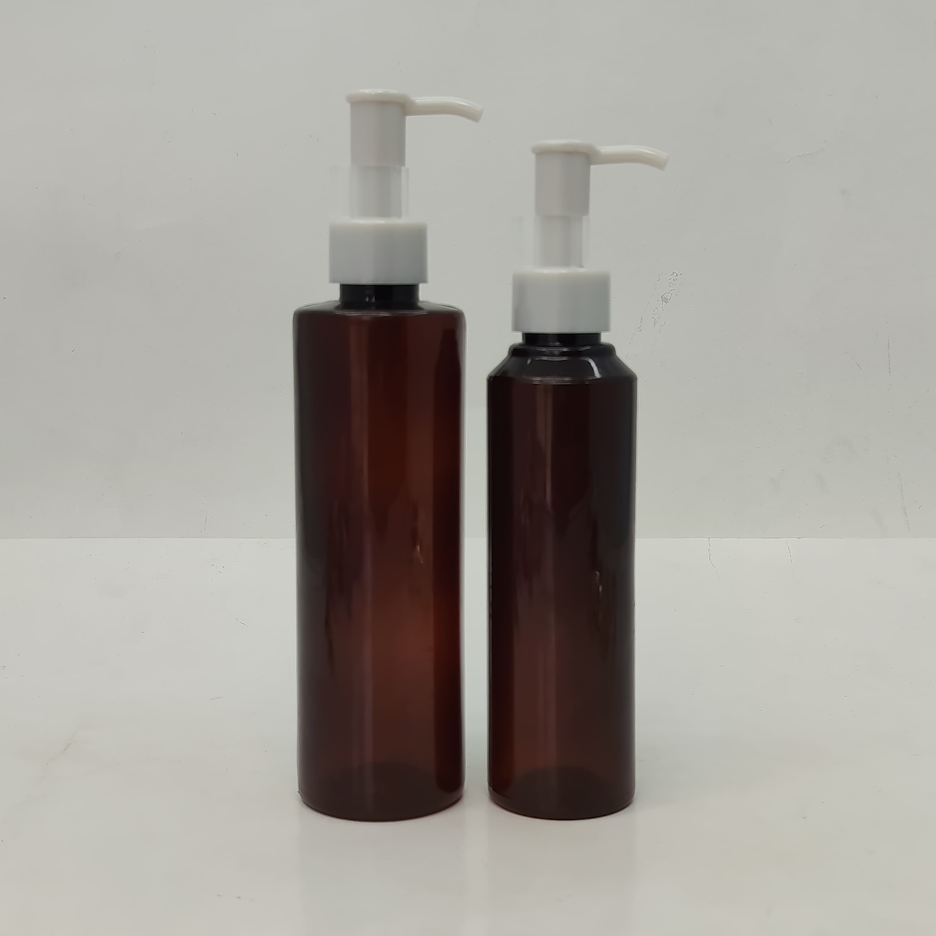Main image of 150ml-200ml Round Amber Bottle - Ivory Cream Pump-Long Neck