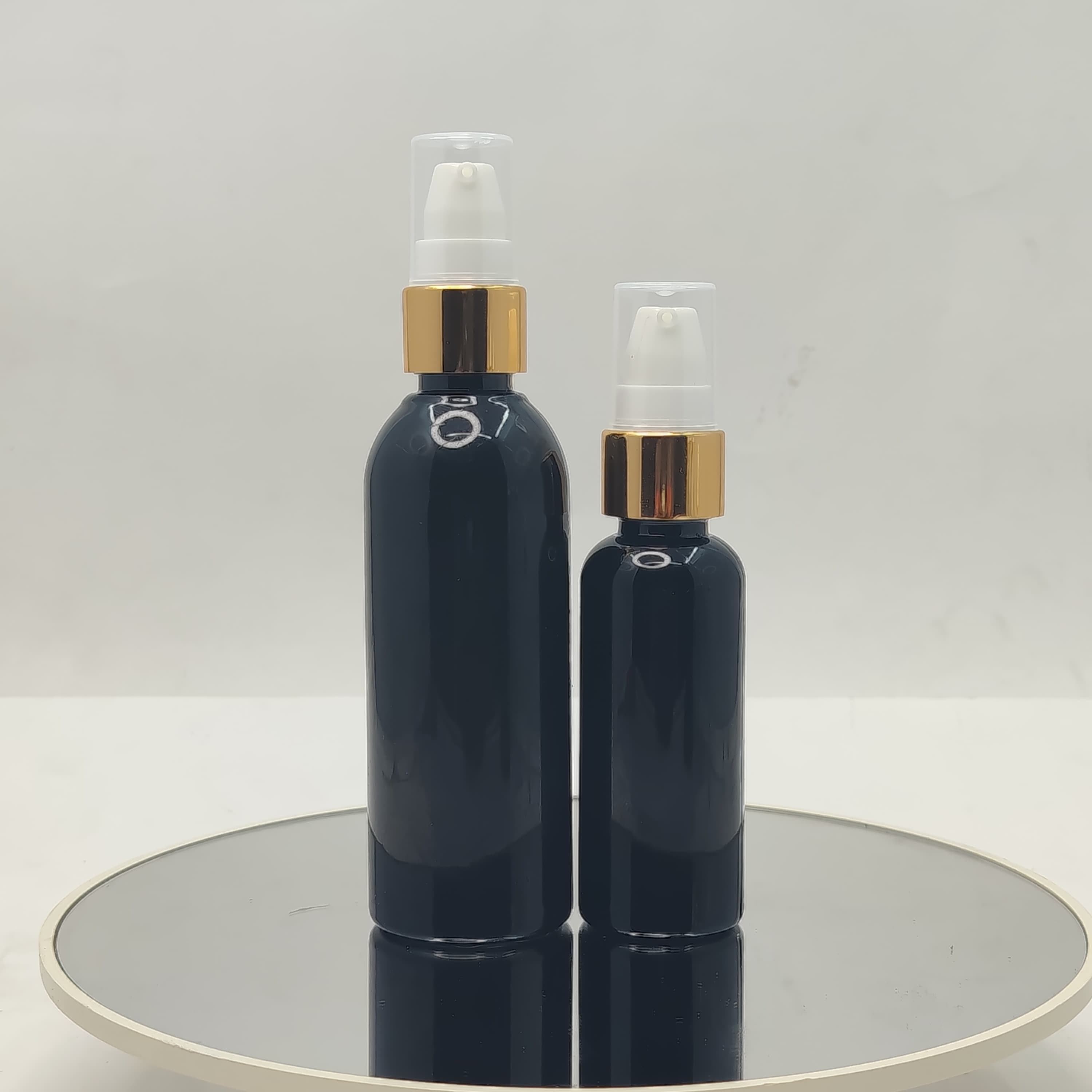Main image of 50ml-100ml Round Bottle Black - Drop Pump Gold