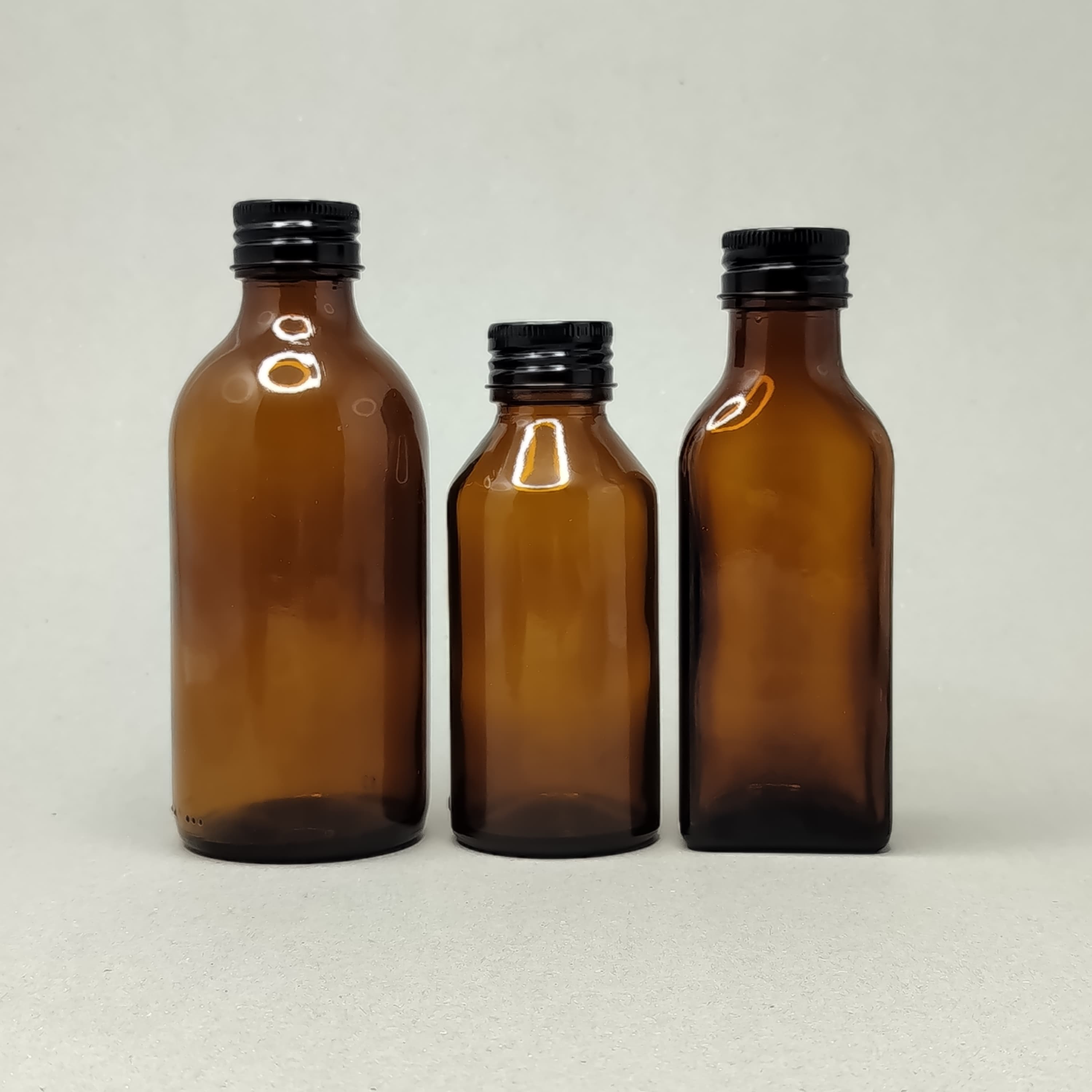 Main image of Amber Glass Bottle - Alu Cap Black