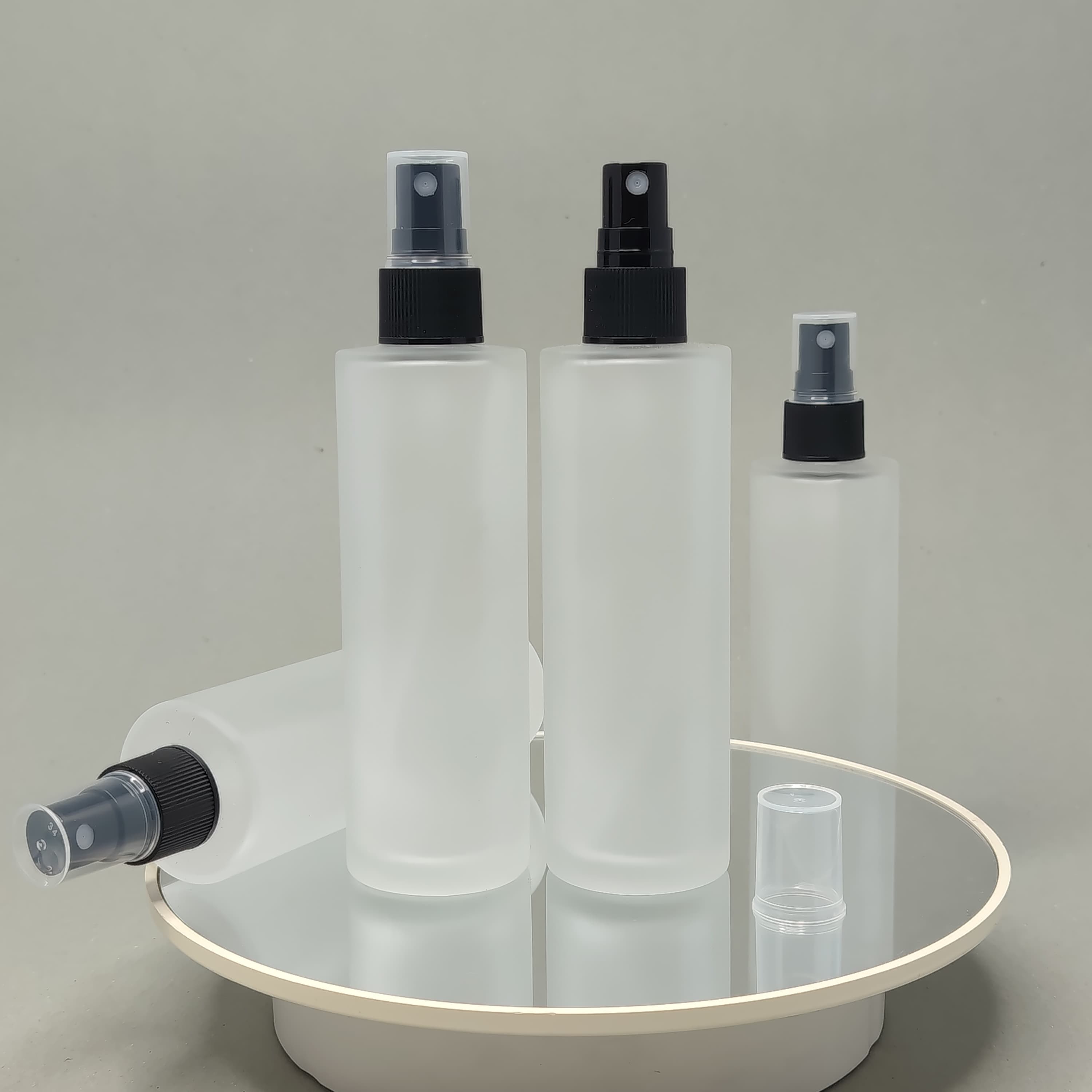 Main image of 100 ml Frosted Glass Bottle - Black Sprayer 