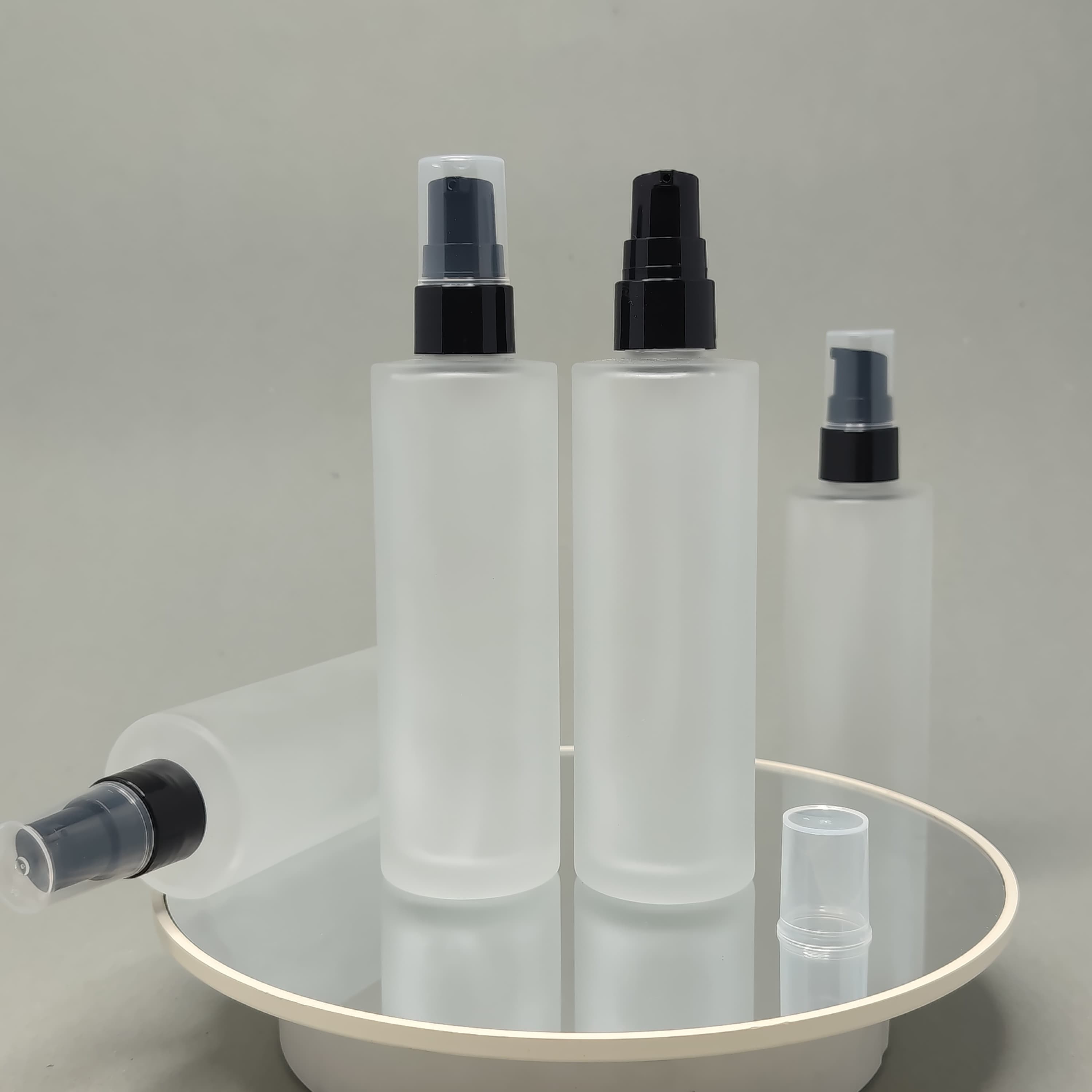 Main image of 100 ml Frosted Glass Bottle - Black Drop Pump 