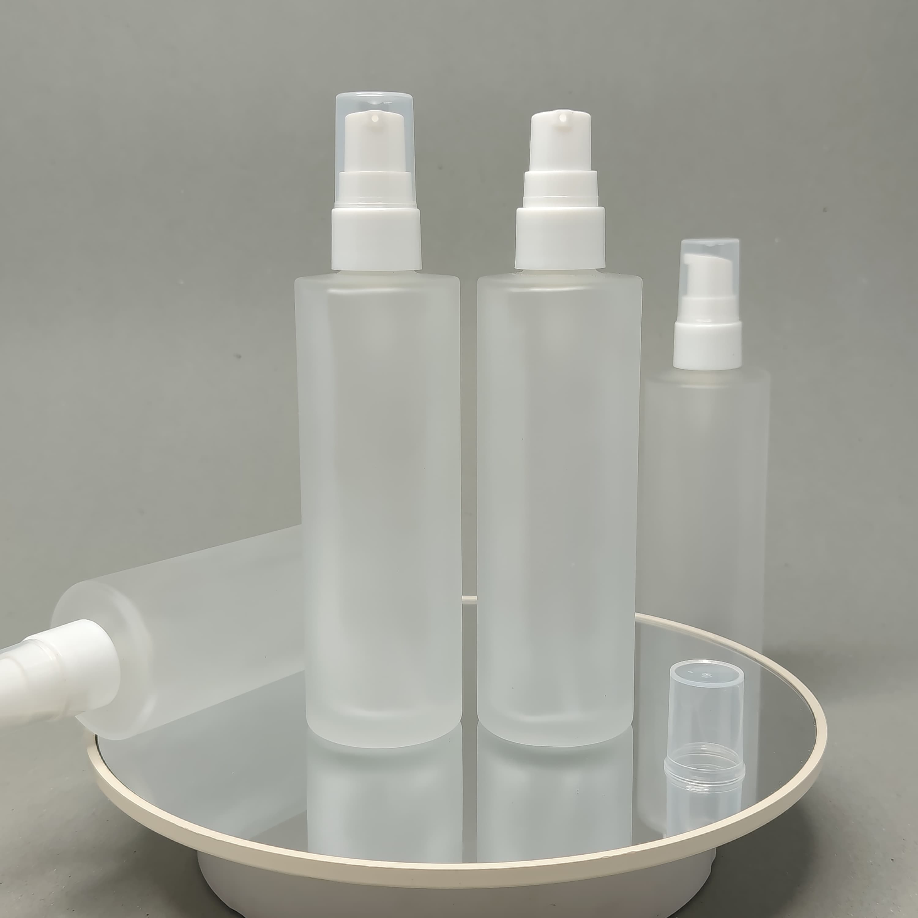 Main image of 100 ml Frosted Glass Bottle - White Drop Pump 